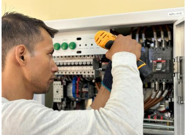 Electrician checking an elecrical outlet